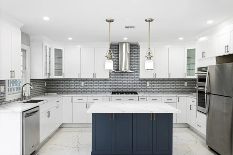 Beautiful new kitchen with white cabinets and blue island in New Jersey